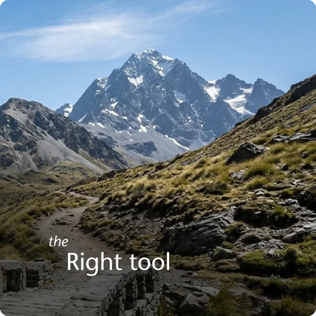 A stable and direct route to higher success, shown through a POV shot of an old stone bridge leading onto a worn alpine trekking track