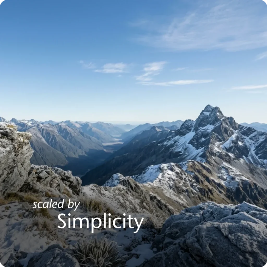A state of autonomy and scaled governance, shown through a POV shot from a snow-dusted summit looking back at a lower peak.